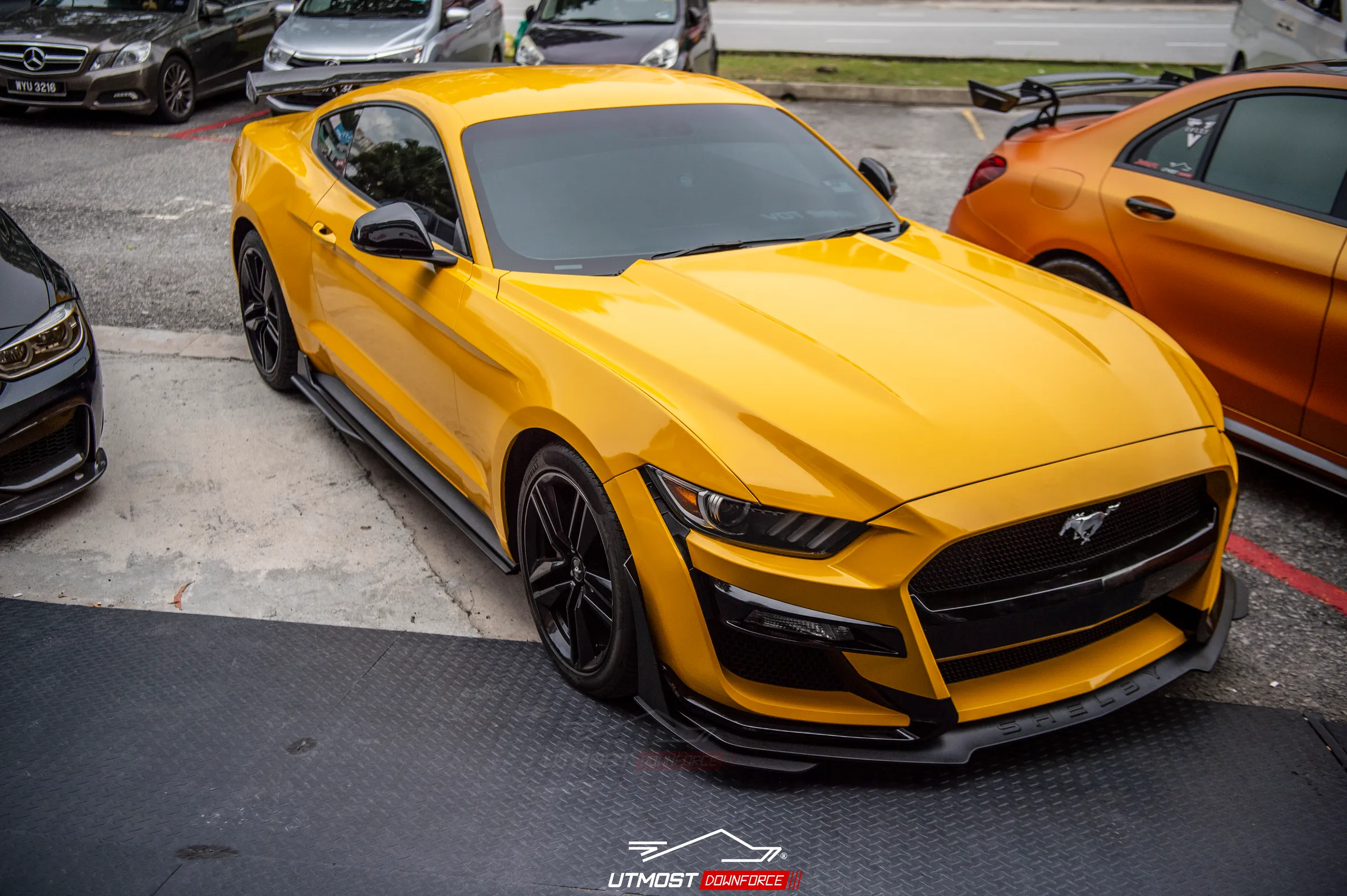 A car wrapped in Gloss Dark Yellow, Gloss film by Avery Dennison