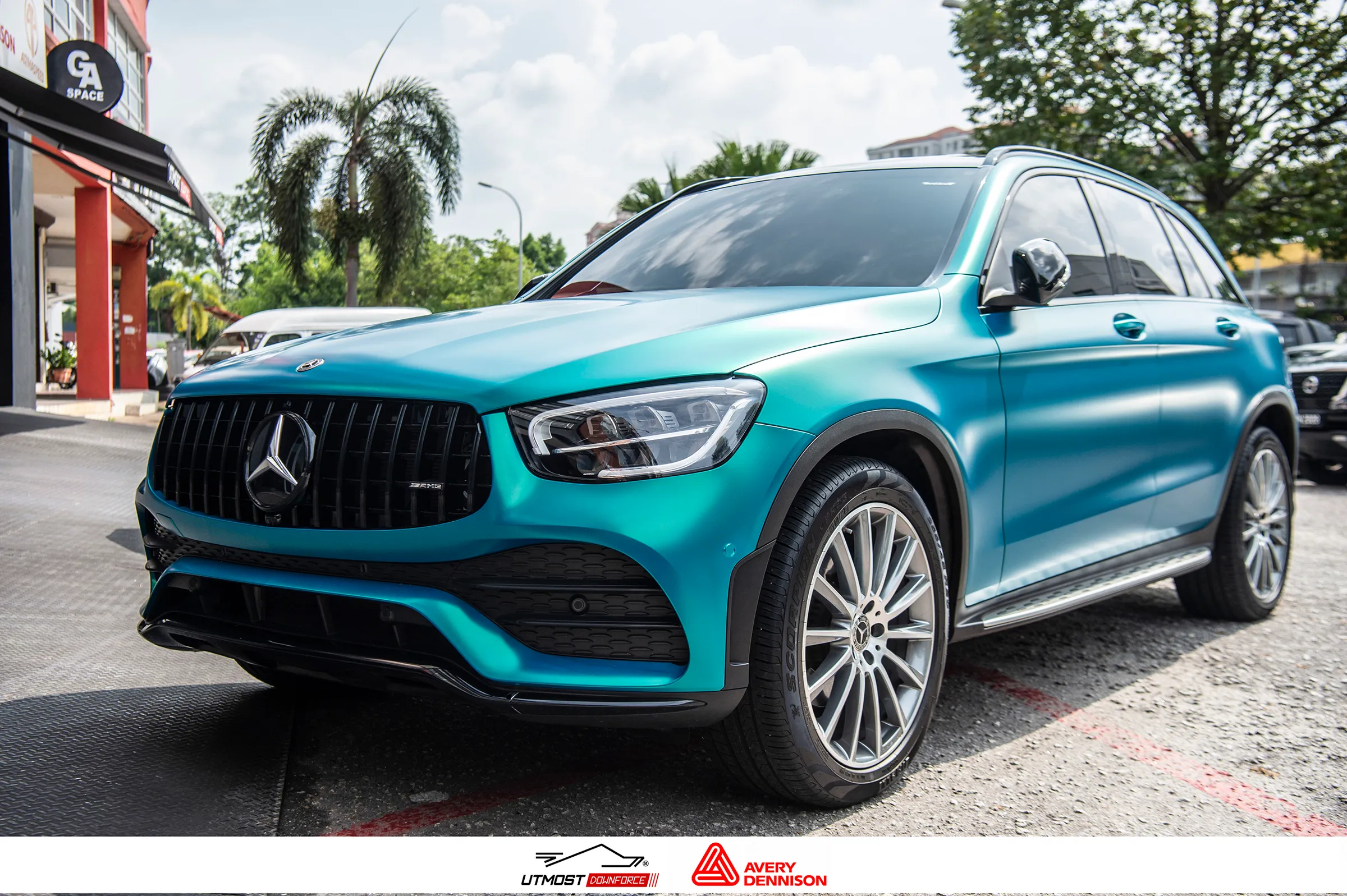 A car wrapped in Satin Cool Teal, Satin film by Avery Dennison