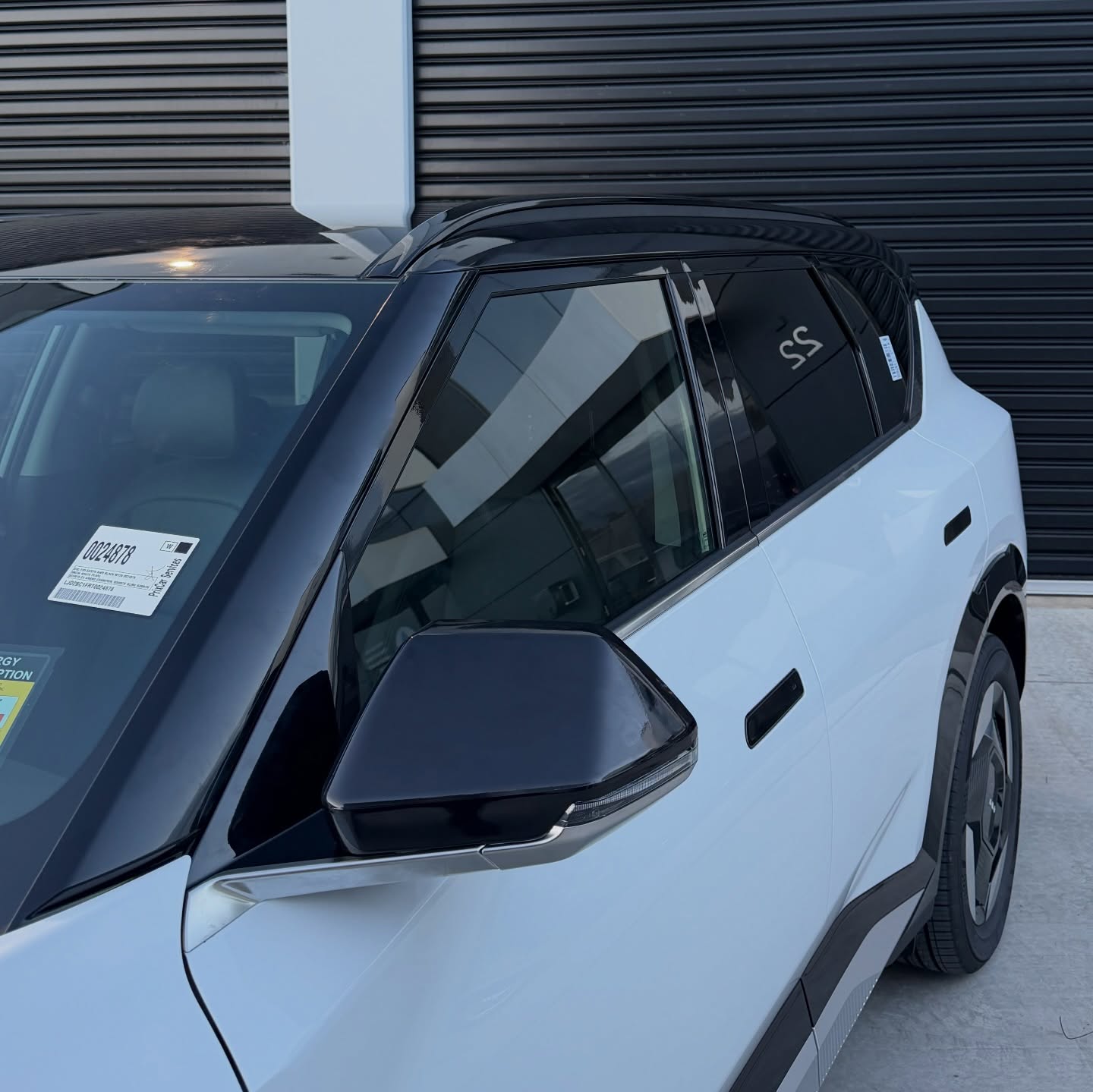 KIA EV5 wrapped in Gloss Obsidian Black, shot 5