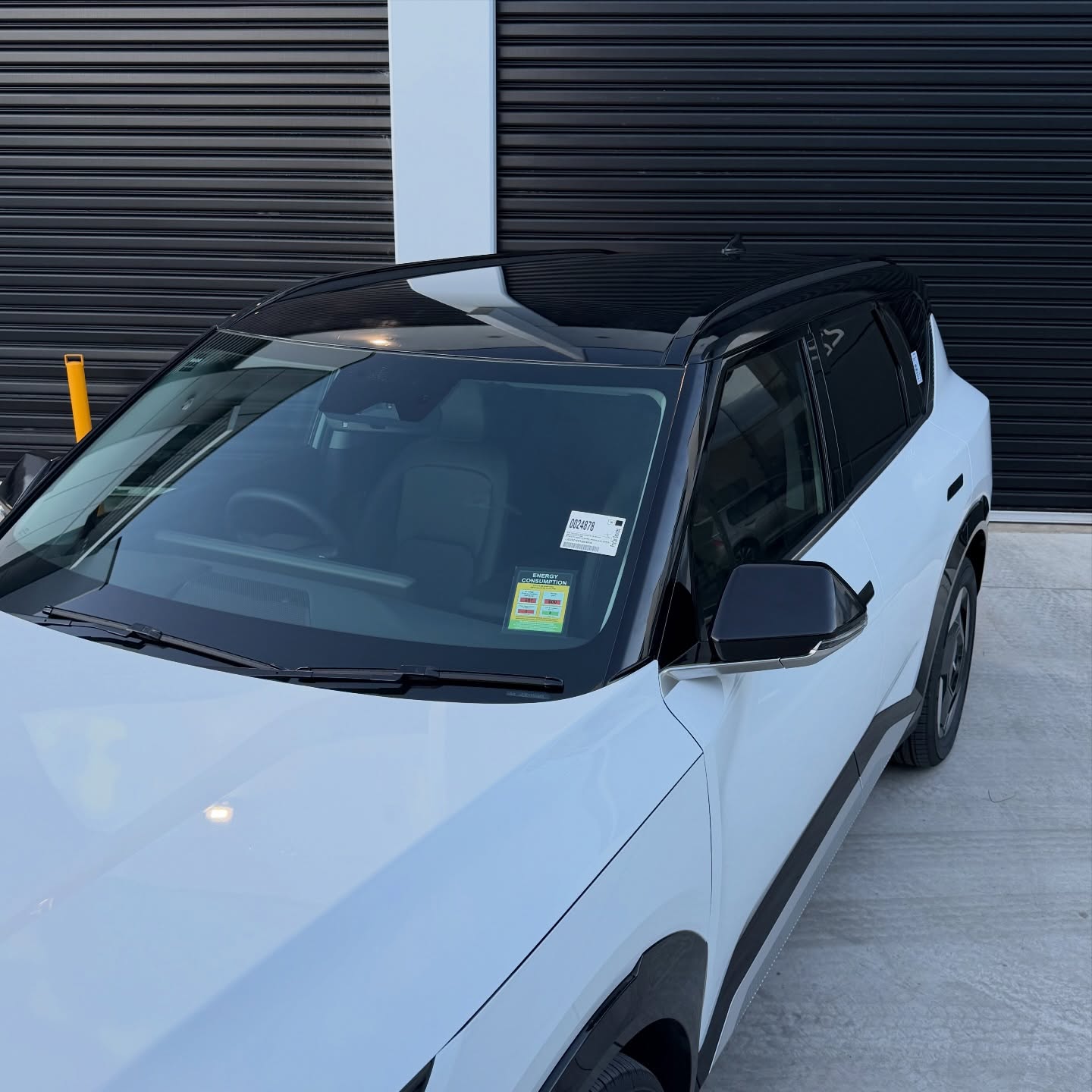 KIA EV5 wrapped in Gloss Obsidian Black, shot 4