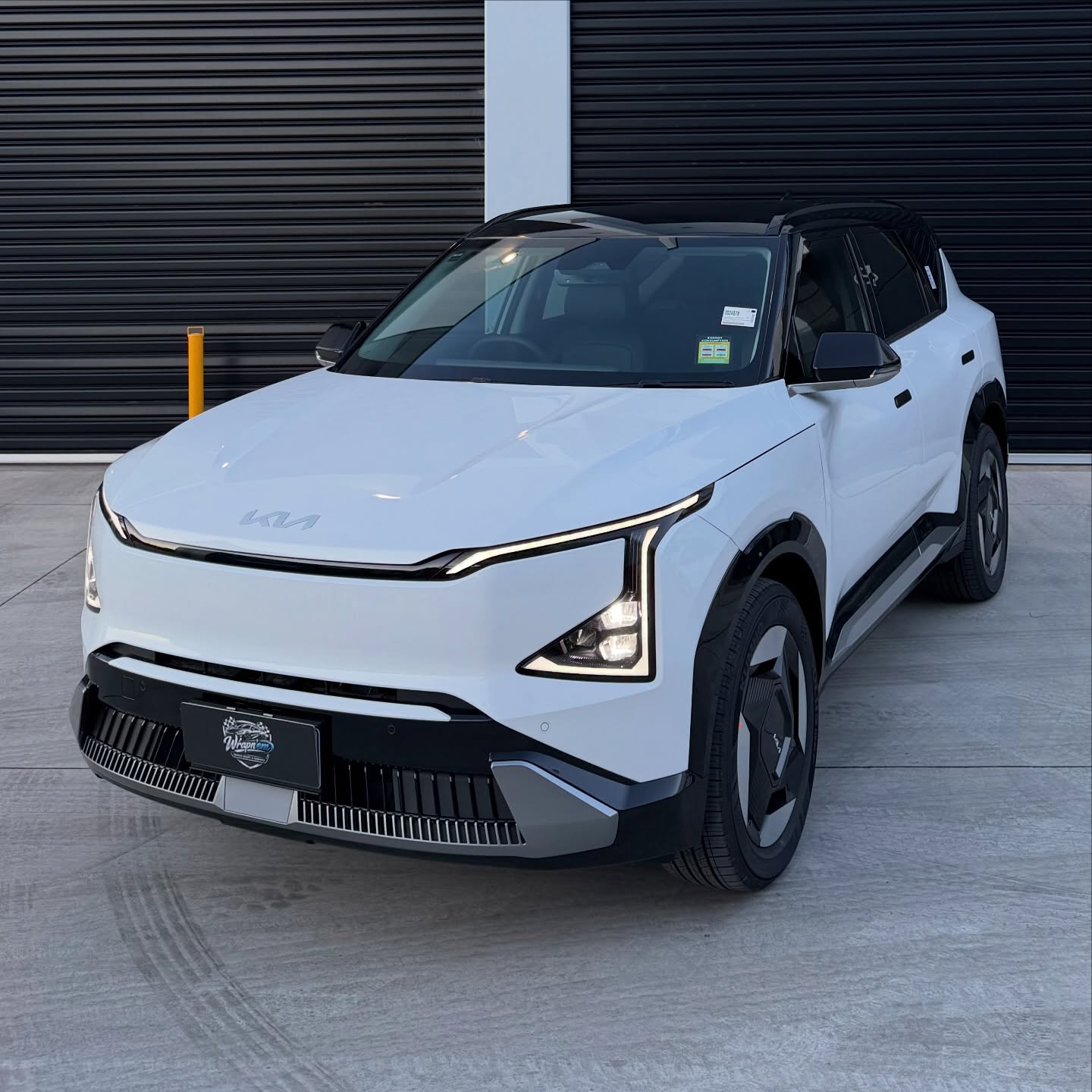 KIA EV5 wrapped in Gloss Obsidian Black, shot 2