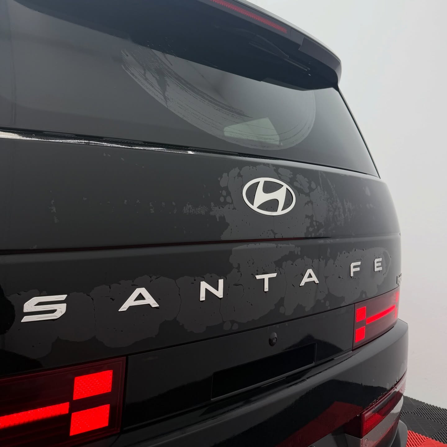 2026 Hyundai Santa Fe wrapped in Gloss Obsidian Black, shot 11