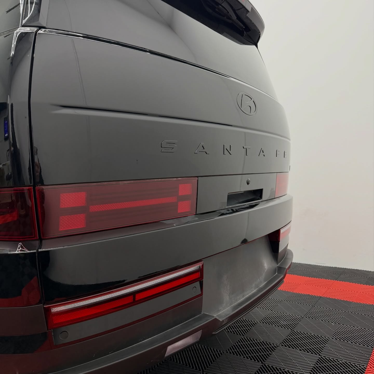 2026 Hyundai Santa Fe wrapped in Gloss Obsidian Black, shot 6