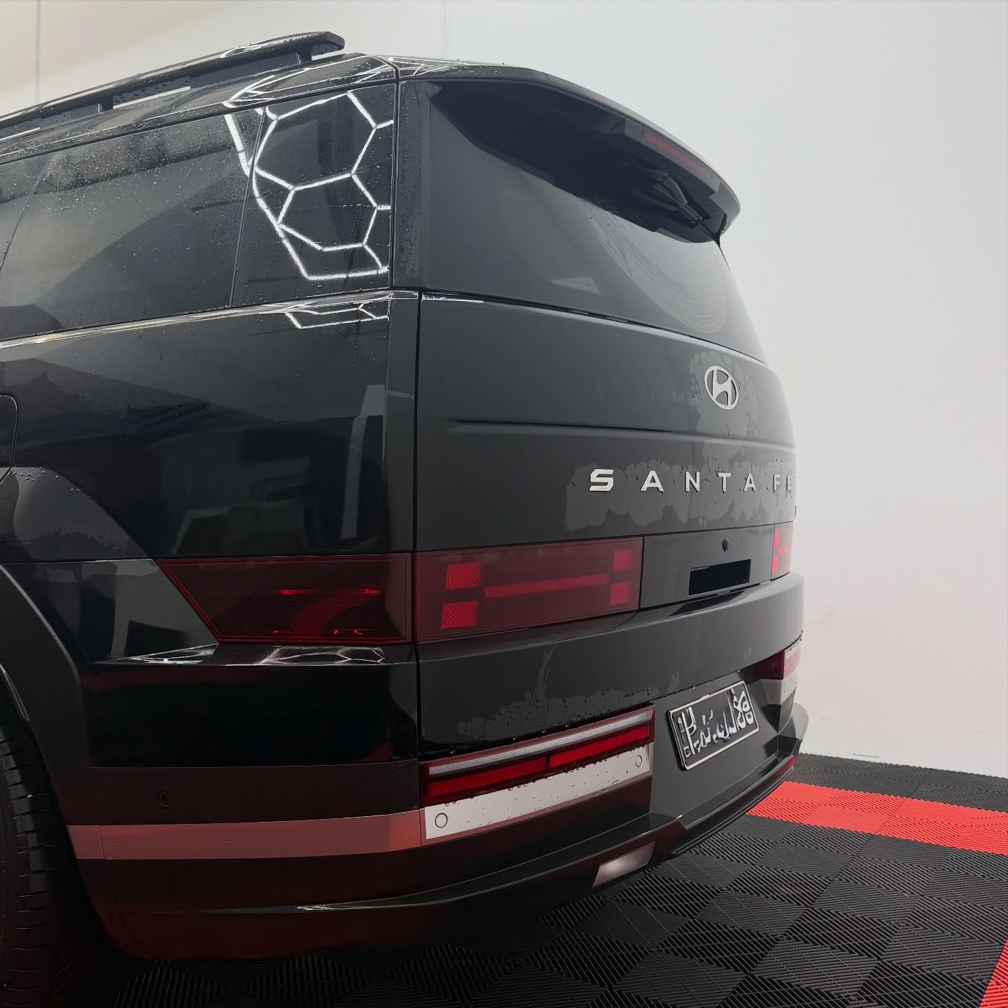 2026 Hyundai Santa Fe wrapped in Gloss Obsidian Black, shot 10