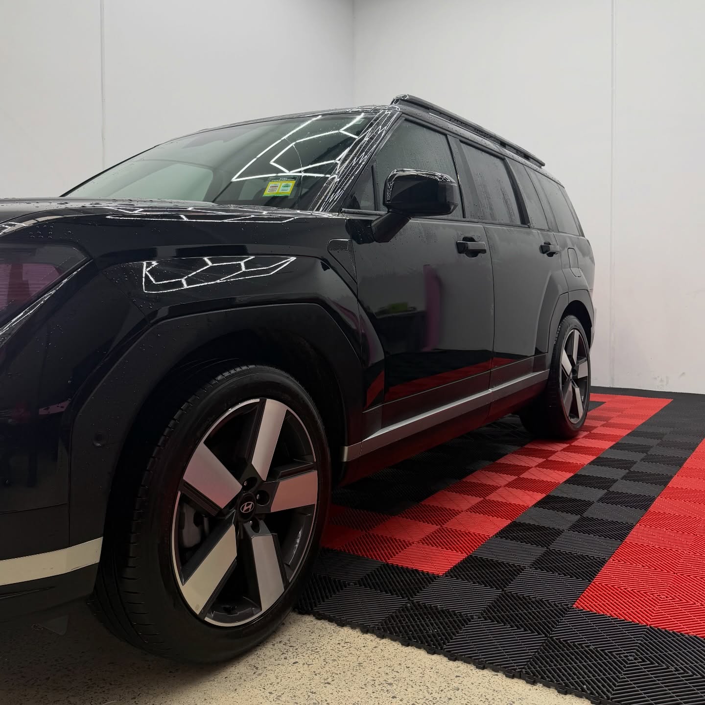 2026 Hyundai Santa Fe wrapped in Gloss Obsidian Black, shot 9