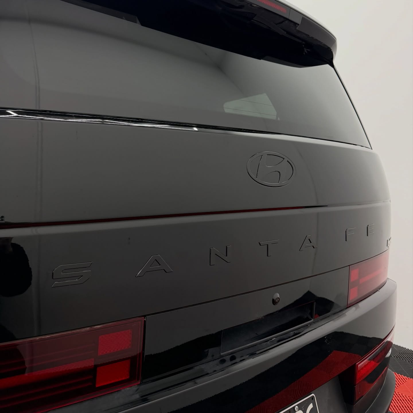 2026 Hyundai Santa Fe wrapped in Gloss Obsidian Black, shot 7