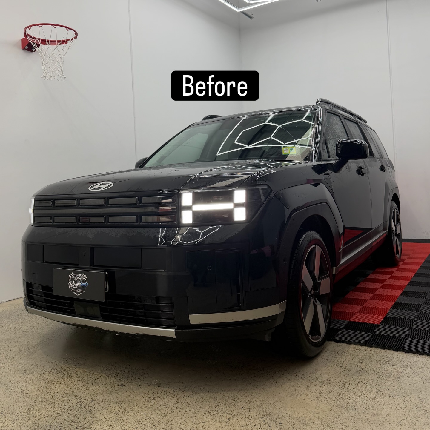2026 Hyundai Santa Fe wrapped in Gloss Obsidian Black, shot 8