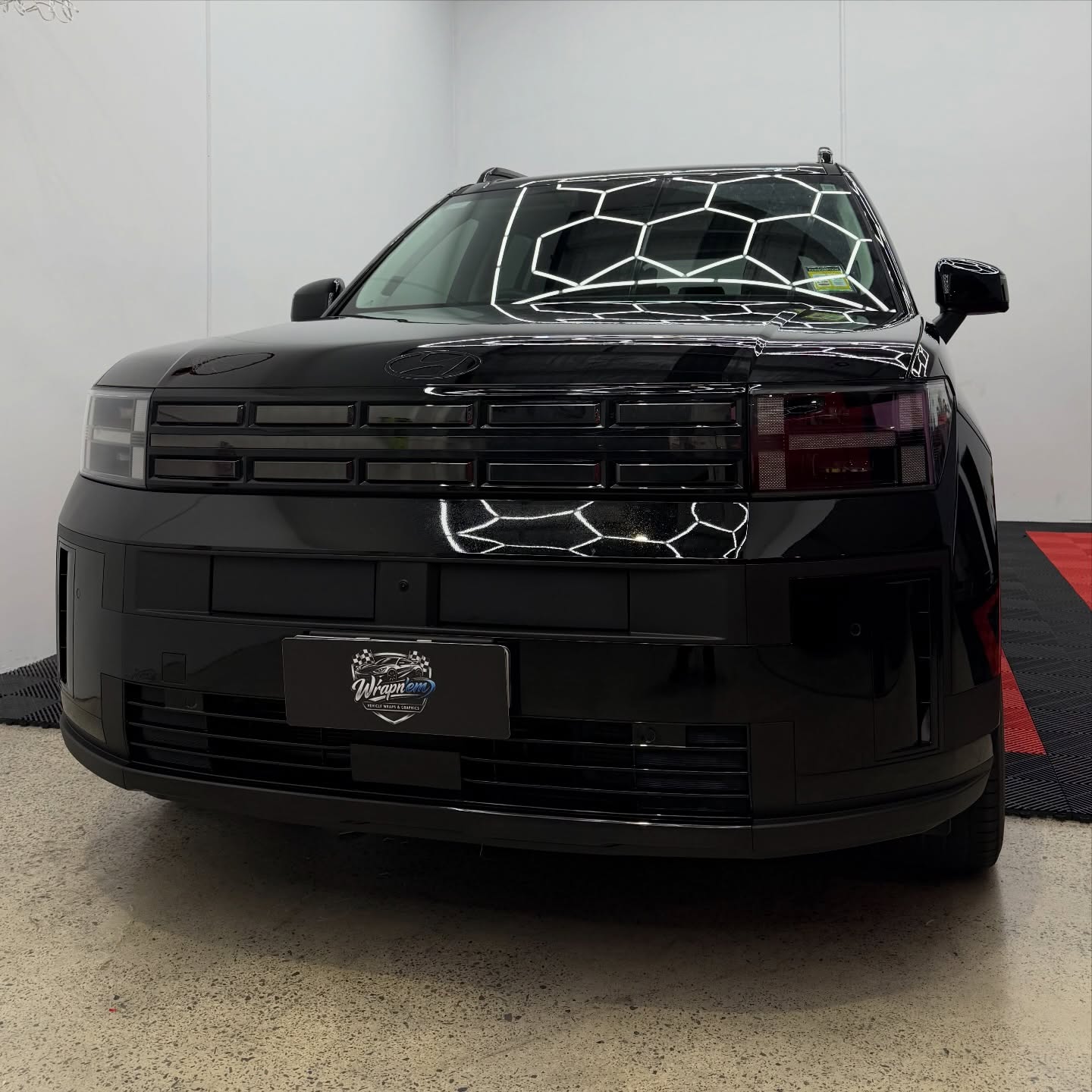 2026 Hyundai Santa Fe wrapped in Gloss Obsidian Black, shot 3