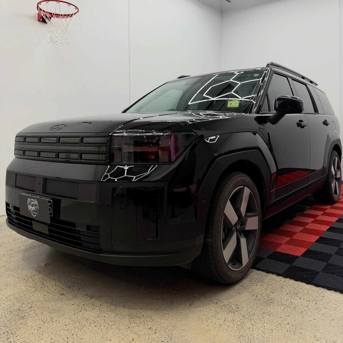 2026 Hyundai Santa Fe wrapped in Gloss Obsidian Black, shot 4