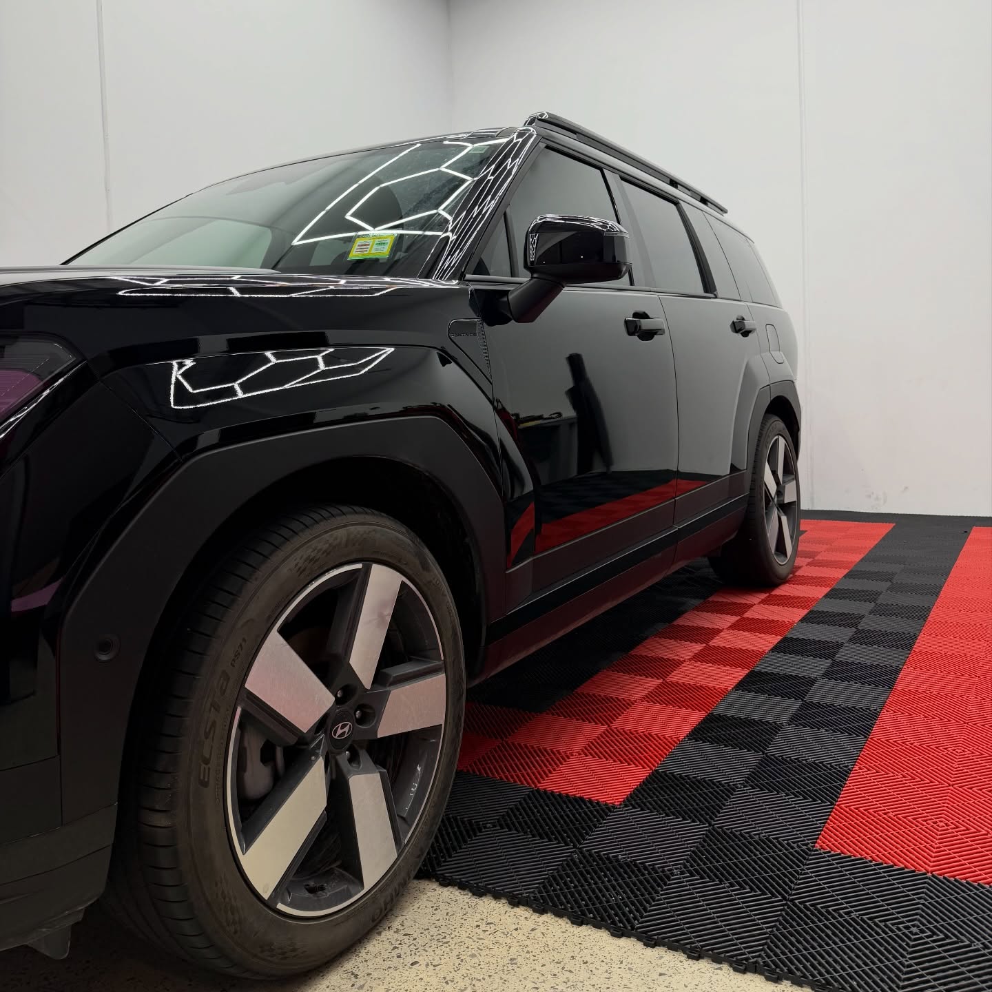 2026 Hyundai Santa Fe wrapped in Gloss Obsidian Black, shot 5