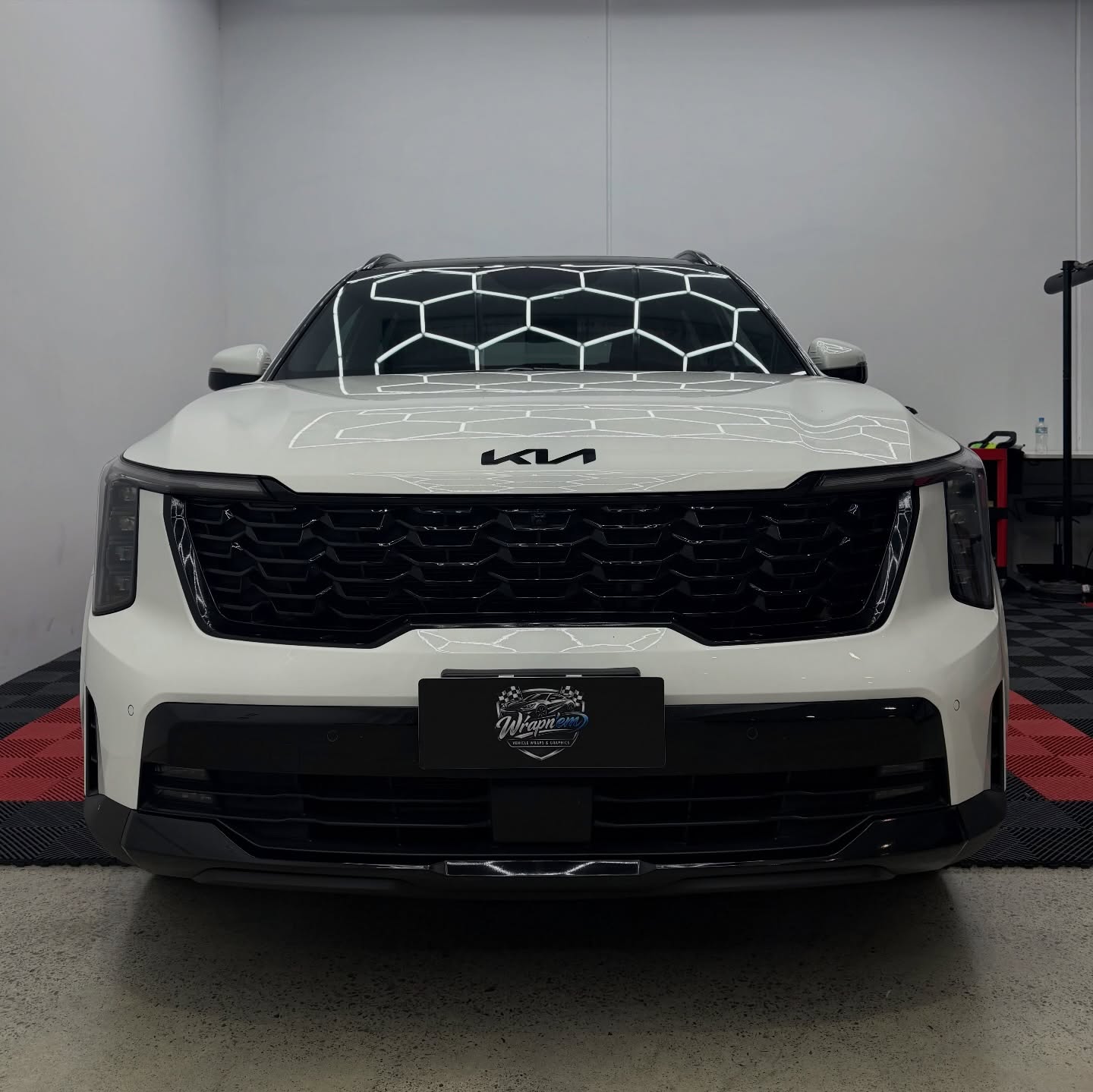 2026 Kia Sorento wrapped in Gloss Obsidian Black, shot 3