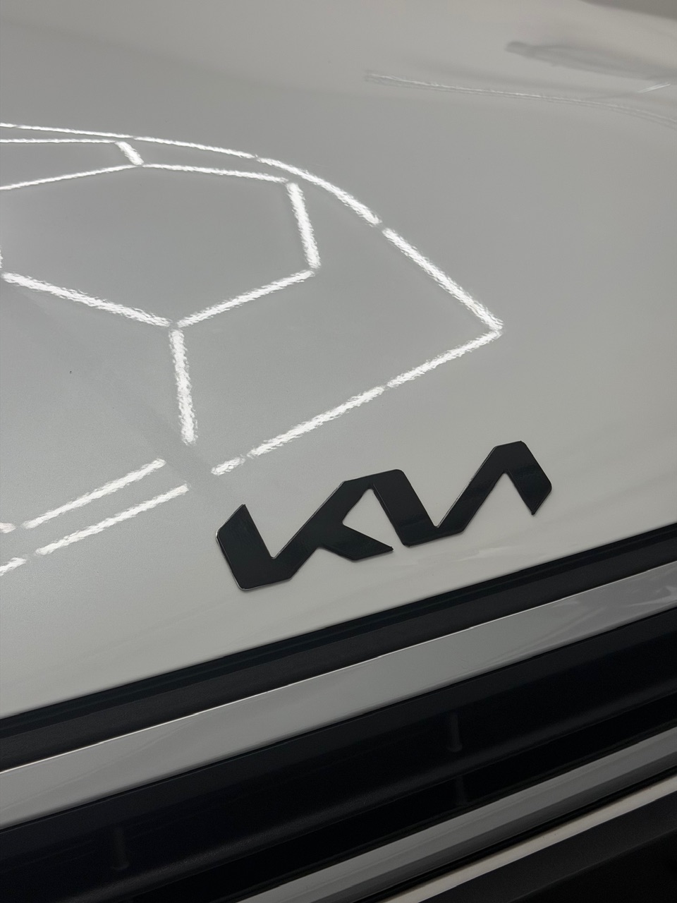 2025 Kia K4 wrapped in Gloss Obsidian Black, shot 3